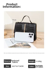 Detail view of black crocodile pattern leather bag with gold hardware and dimensions
