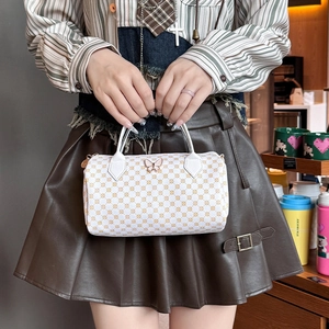 Polka dot white pillow handbag with butterfly hardware and top handle for women