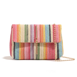 Colorful woven crossbody bag with rainbow stripes, gold fringe buckle, and chain strap