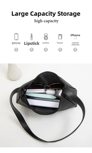 Spacious interior of black pebble leather shoulder bag holding daily essentials and accessories
