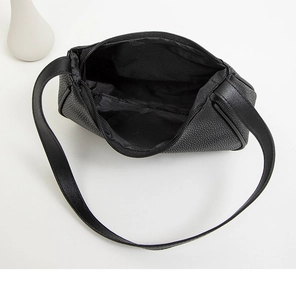 Top view of black litchi grain leather shoulder bag showing interior fabric lining