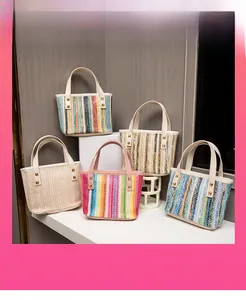 Close-up of colorful woven mini tote bags with metallic rivet handle accents