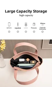 Internal view of the high-capacity pink bag showing storage for phone and cosmetics