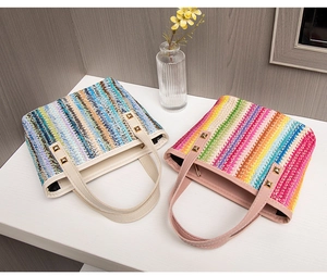 Detail of colorful woven tote bags with leather handles and gold rivet accents