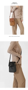 Close-up of letter print leather phone crossbody bags with metal buckle and zippers