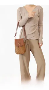 Chic brown monogram crossbody bag with gold buckle hardware and slim adjustable strap