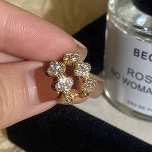 Luxury gold four-leaf clover hoop earrings with zircon pavé setting for women