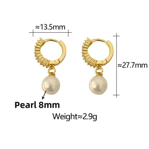 Detail view of gold C-shape earrings with 8mm shell pearl and zircon, dimensions shown