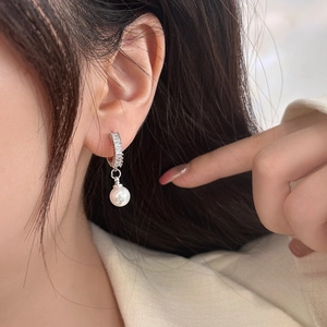 Elegant pearl drop earrings with zircon-inlaid silver hooks for a minimalist luxury look