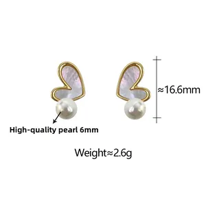 Detail view of heart shell earrings with 6mm pearls, 16.6mm height and 2.6g weight