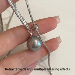 Adjustable silver snake chain necklace with large grey pearl pendant and zircon details