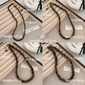 Comparaison de perles d'oeil de tigre de 4mm à 10mm avec détail de fermoir doré