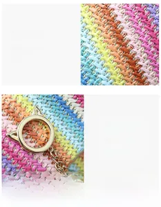 Detail of colorful woven straw fabric and golden cat-ear metal ring on a small square bag