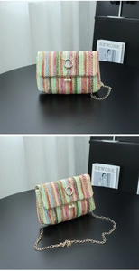 Detail of colorful woven straw bag with wave texture and pearl cat ear metal clasp