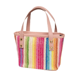 Colorful striped straw tote bag with pink leather handles and golden rivet accents