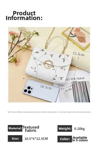Size comparison of floral embroidered bag with pearls and dimensions 18.5x6x12.5cm