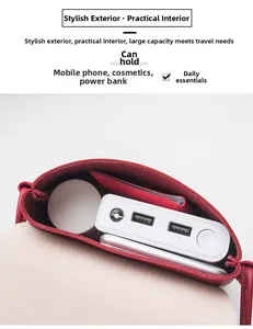 Internal compartments of the red leather crossbody bag showing spacious storage capacity