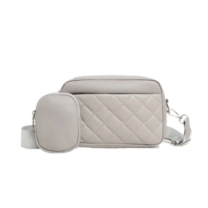 Quilted light gray crossbody camera bag with adjustable strap and detachable coin purse