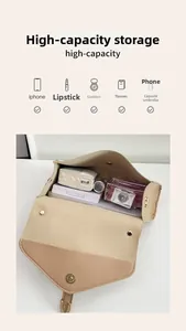 Internal storage view of the light brown crossbody bag showing space for daily essentials