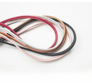 Detailed shot of multi-colored leather shoulder straps with premium stitching crafts