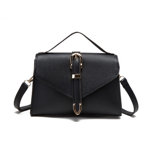 Classic black leather crossbody bag with gold buckle detail and detachable strap