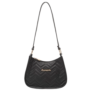 Close-up of black shoulder bag with V-shaped quilting and golden metal logo detail