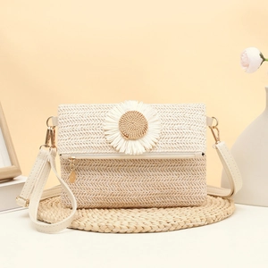 Summer straw crossbody bag with white daisy flower detail on cream woven material