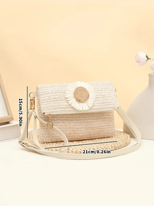 Detail view of woven straw daisy bag showing dimensions of 21cm width and 15cm height
