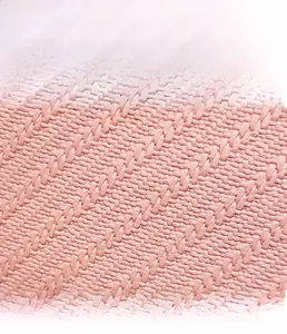 Macro detail of the pink woven fabric texture on a ladies stylish bucket bag