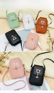 Detail of PU leather crossbody bags with woven texture and pearl tassel charms
