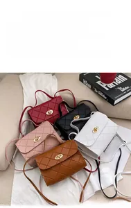 Detailed display of quilted crossbody handbags in red, black, white, pink, and brown
