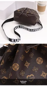 Detailed view of dark brown bucket bag's premium geometric texture and stylish strap