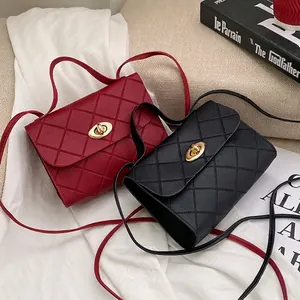 Quilted crossbody handbags in black and burgundy with gold turn-lock and chain straps