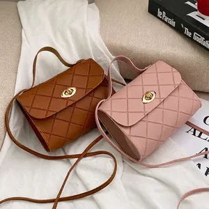 Quilted flap crossbody handbags in brown and pink leather with golden twist locks
