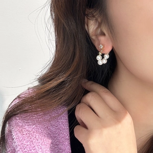 Elegant gold pearl hoop earrings for women featuring white beads and sparkling crystal studs
