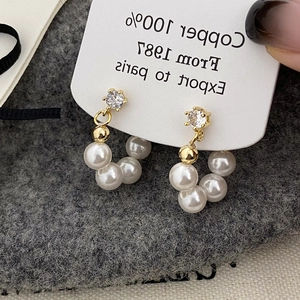 Elegant gold pearl cluster earrings with white pearls and sparkling cubic zirconia stud