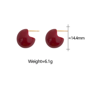 Macro view of burgundy red enamel C-shaped earrings with size and weight specs