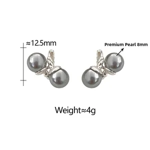 Macro detail of twisted metal earrings with twin 8mm pearls and technical dimensions