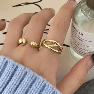 Minimalist gold overlapping and open rings set for women worn on index finger