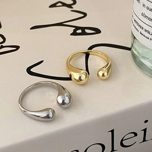 Minimalist crisscross open rings in gold and silver finish with teardrop ends