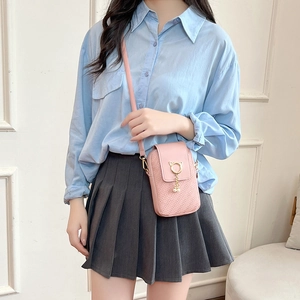 Pink mini crossbody phone bag for women with gold cat buckle and pearl tassel detail