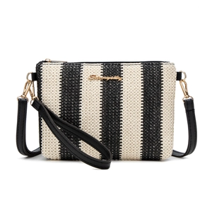 Striped woven straw crossbody bag with black faux leather trim and gold hardware
