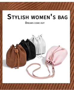 Detail of drawstring bucket bags in corduroy fabric showing brown, black, white, and pink options