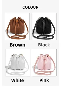 Detail view of corduroy drawstring bucket bags in brown, black, white, and pink