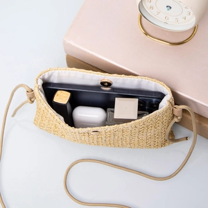 Chic beige woven straw crossbody bag with magnetic closure for summer outings