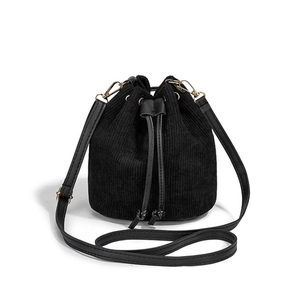 2025 minimalist black corduroy drawstring bucket bag with gold hardware and leather strap