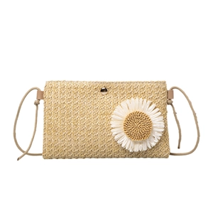 Straw woven crossbody bag for women with white daisy detail and gold metal buckle