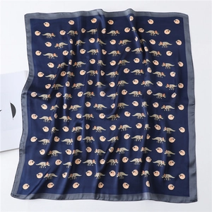 Navy blue silk-like square scarf with cartoon dinosaur pattern and grey border