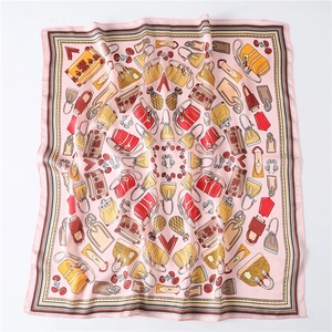Pink silk square scarf featuring retro luxury handbag motifs and elegant border stripes