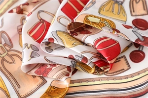 Close-up of silky 70cm square scarf featuring vintage handbag and accessory prints